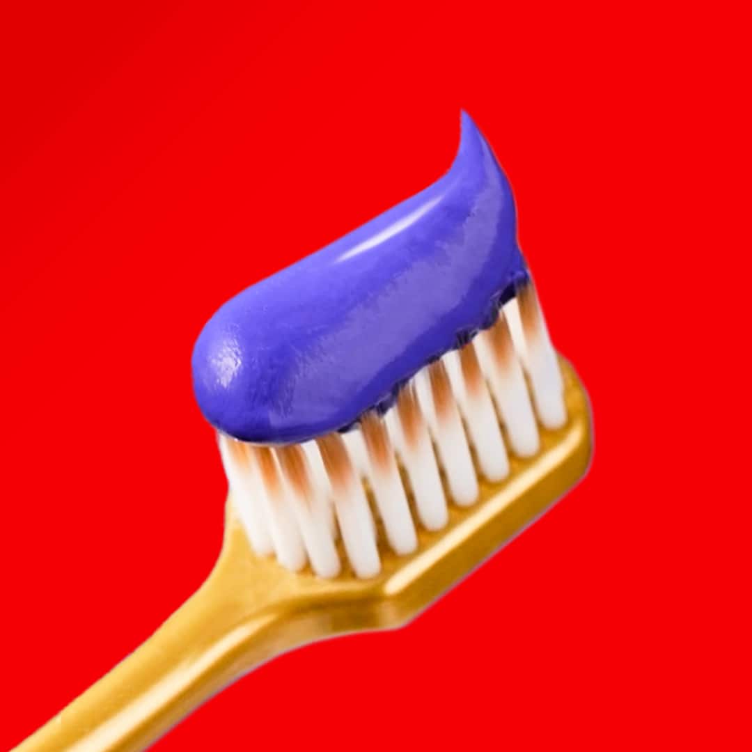 The Colgate Optic White Purple Whitening Toothpaste with unique purple experience bubbling up on a purple background 