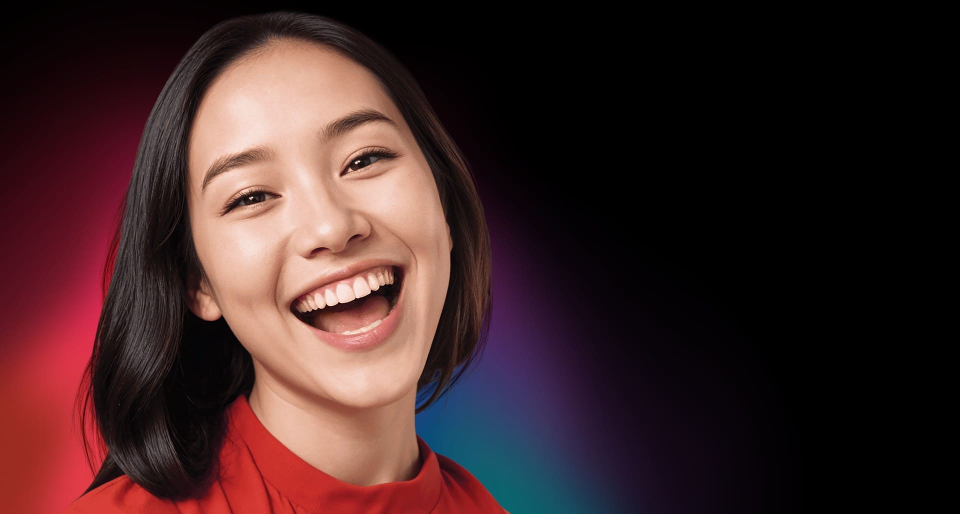 Woman smiling out loud; image used for introducing Colgate's best teeth whitening product
