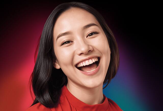 Woman smiling out loud; image used for introducing Colgate's best teeth whitening product