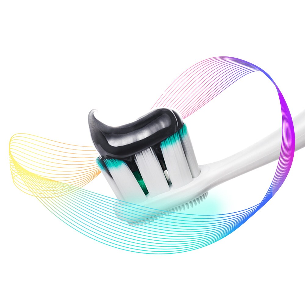 Kepala sikat gigi Colgate Total dengan pasta di atasnya, dikelilingi oleh sinar pencegahan warna-warni